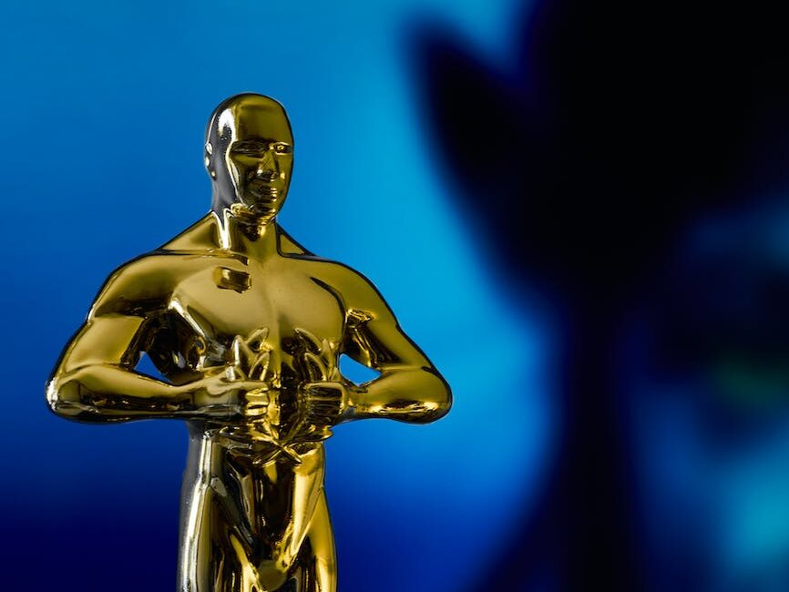 academy award in front of blue alien character