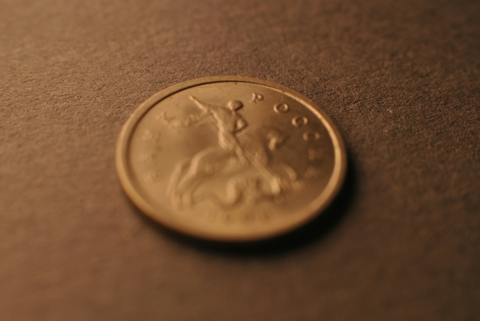 A close up of a coin on a table