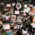 assorted books on brown wooden shelf